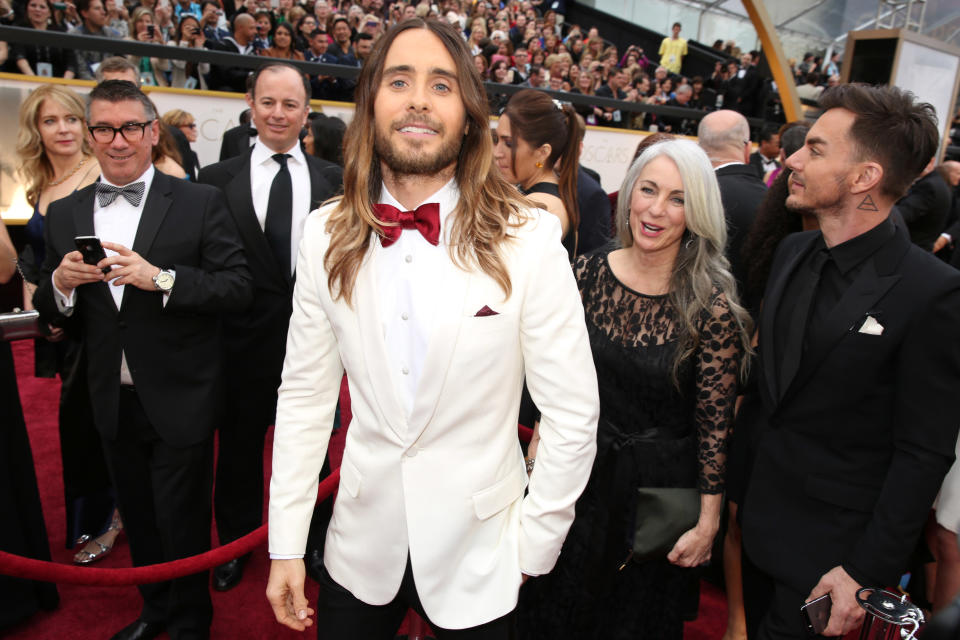 Jared Leto, center, arrives with his mother Constance and brother Shannon at the Oscars on Sunday, March 2, 2014, at the Dolby Theatre in Los Angeles. (Photo by Matt Sayles/Invision/AP)