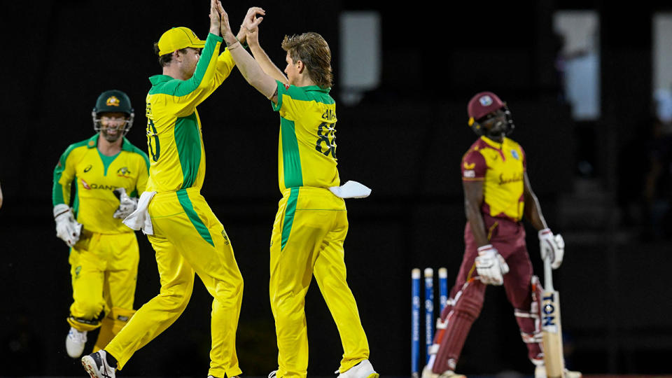 Adam Zampa and Ashton Turner, pictured here celebrating the dismissal of Andre Fletcher.