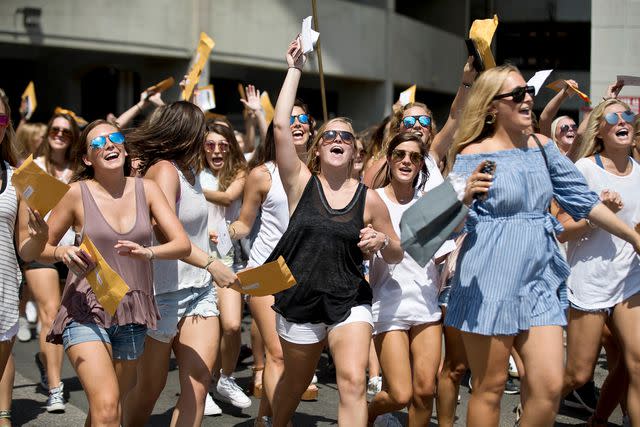 <p>AP Photo/Brynn Anderson</p> Sorority girls run after in excitement after receiving their sorority's bid for recruitment during the University of Alabama Bid Day, Saturday, Aug. 19, 2017, in Tuscaloosa, Ala.