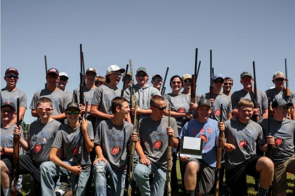 The C-G-B Trapshooting team lines up for a team photo.