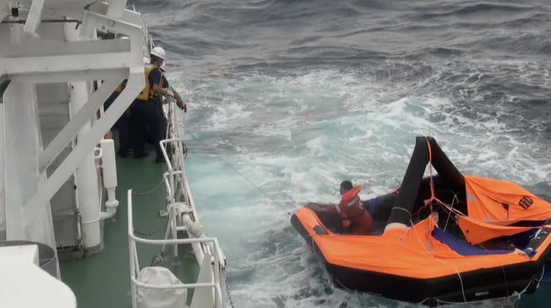 Filipino crew member of Gulf Livestock 1 is rescued by Japan Coast Guard crew on vessel Kaimon, at the East China Sea