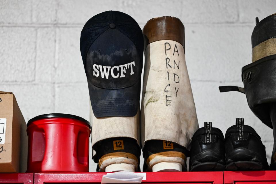 Boots, shoes and a coffee cup are placed on a shelf in the bay of Station 42, located at 19971 Kern Road, South Bend.