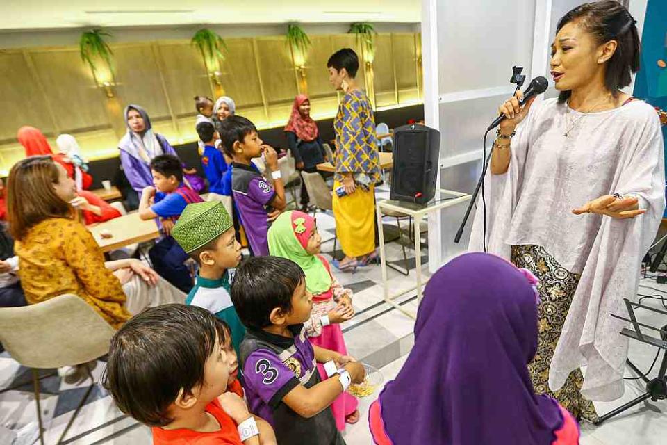 Singer Atilia Haron serenades guests at the launch of The Power to Empower. — Picture by Hari Anggara