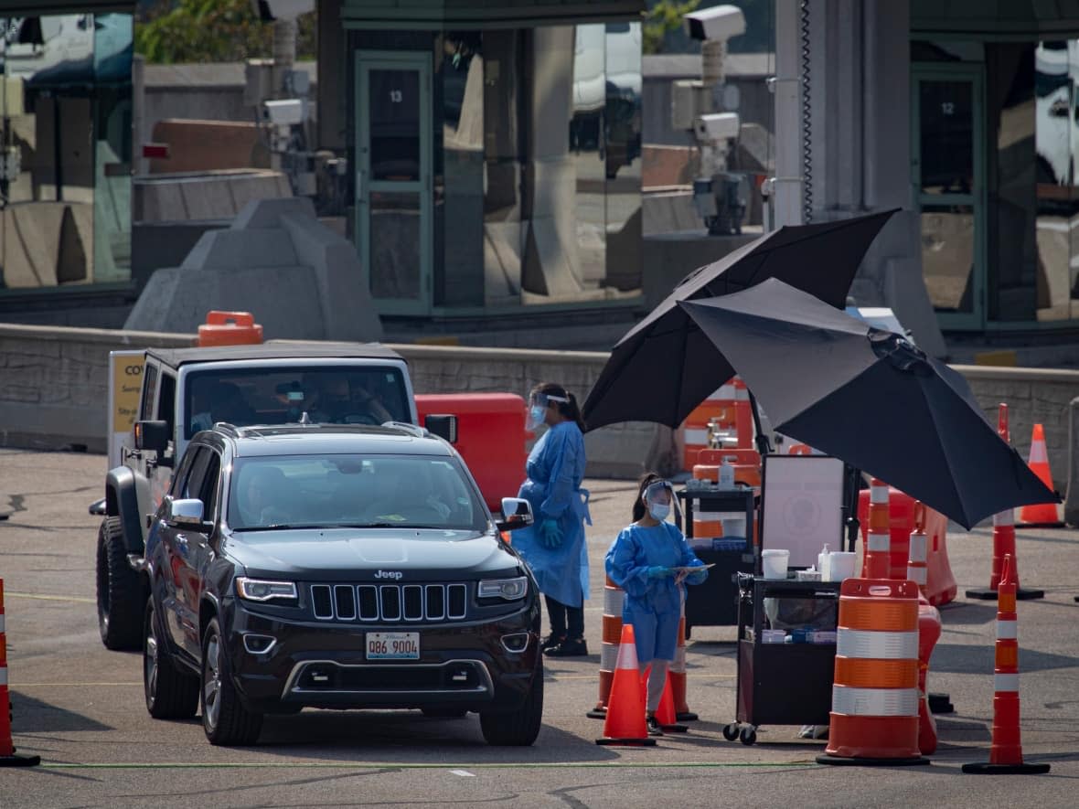 Crossing the Canada-U.S. border into Ontario, travellers are required to provide a negative COVID-19 test result.  (Evan Mitsui/CBC - image credit)