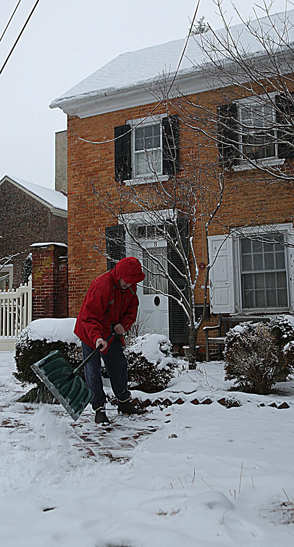 D.J. Levine shovels snow outside of his home in Old New Castle on Friday January 19, 2024.