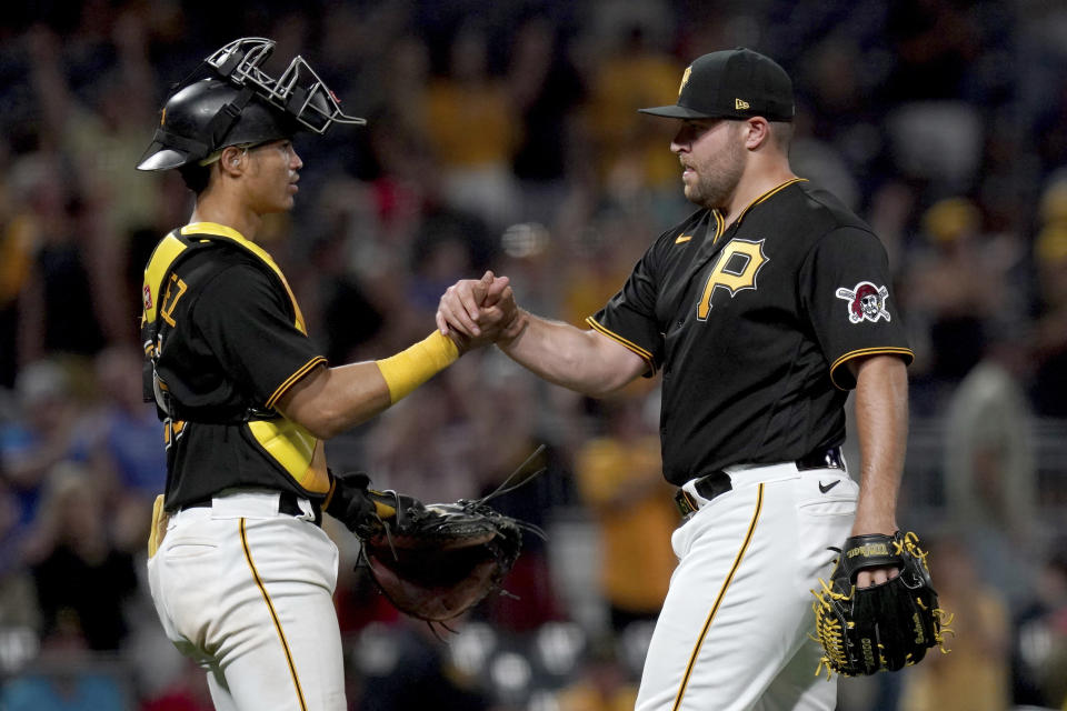 Pittsburgh Pirates relief pitcher David Bednar celebrates with catcher Endy Rodriguez after getting the final out against the St. Louis Cardinals in the ninth inning of a baseball game in Pittsburgh, Tuesday, Aug. 22, 2023. (AP Photo/Matt Freed)