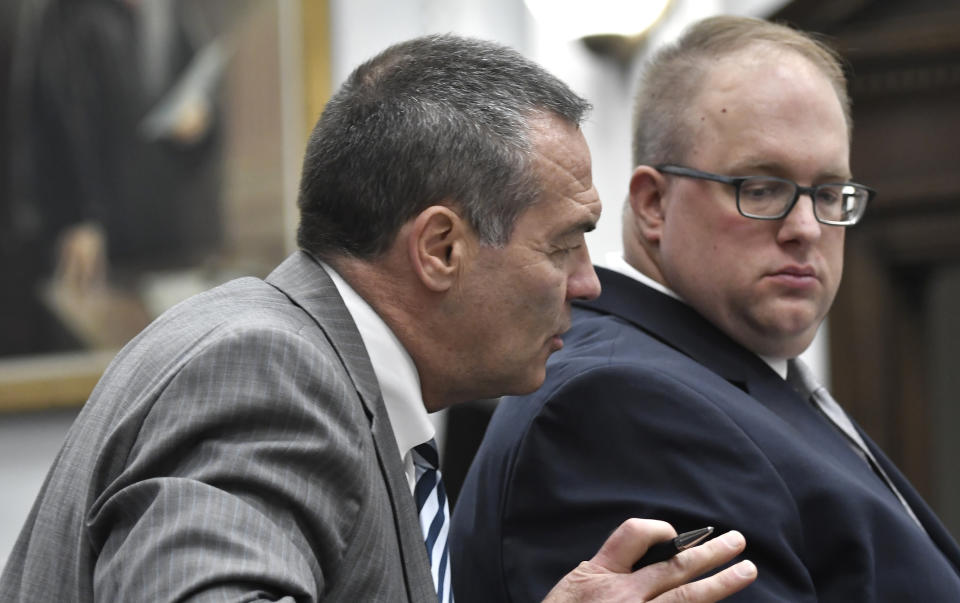 Mark Richards, Kyle Rittenhouse's lead attorney, left, speaks with Assistant District Attorney James Kraus, right, as Kraus questions witness Dr. Douglas Kelley, a forensic pathologist with the Milwaukee County Medical Examiner's Office, during Rittenhouse's trial at the Kenosha County Courthouse in Kenosha, Wis., on Tuesday, Nov. 9, 2021. Rittenhouse is accused of killing two people and wounding a third during a protest over police brutality in Kenosha, last year. (Sean Krajacic/The Kenosha News via AP, Pool)