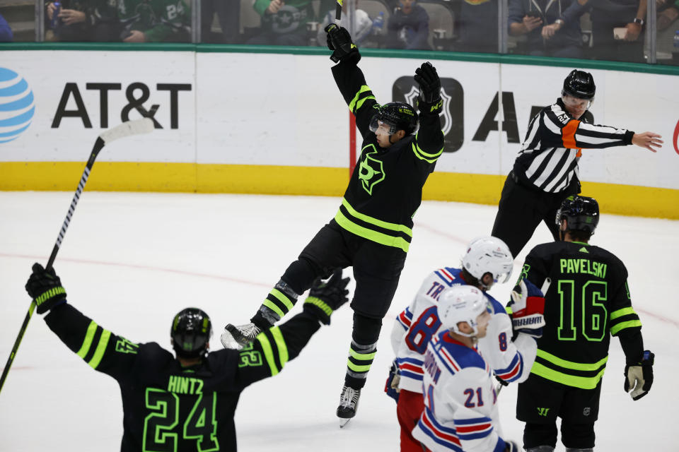 Dallas Stars left wing Jason Robertson, center, celebrates his goal against the New York Rangers during the second period of an NHL hockey game in Dallas, Saturday, Oct. 29, 2022. (AP Photo/Michael Ainsworth)