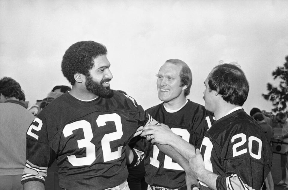 Steelers quarterback Terry Bradshaw and running back Franco Harris joke around before the Super Bowl in 1979