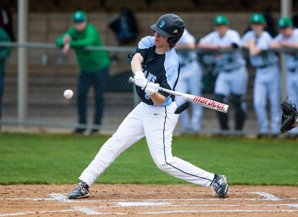 Saint Joseph's Jack Quinn takes a swing during the Saint Joseph vs. Concord baseball game Tuesday, April 12, 2022 at Concord High School. 