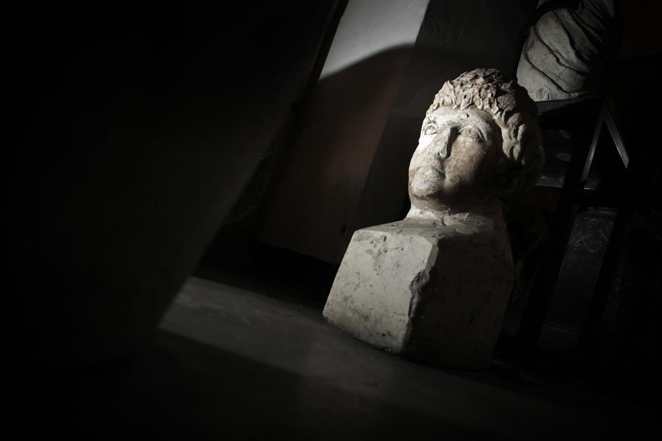 This Friday, Oct. 5, 2012 photo shows ancient Roman sculpture, found on the site of Ratiaria, an ancient Roman settlement located on the banks of the Danube, in the northwest corner of Bulgaria. Located on the crossroads of many ancient civilizations, Bulgarian scholars rank their country behind only Italy and Greece in Europe for the numbers of antiquities lying in its soil. But Bulgaria has been powerless to prevent the rape of its ancient sites, depriving the world of part of its cultural legacy and also costing this impoverished Balkan nation much-needed tourism revenue. (AP Photo/Valentina Petrova)