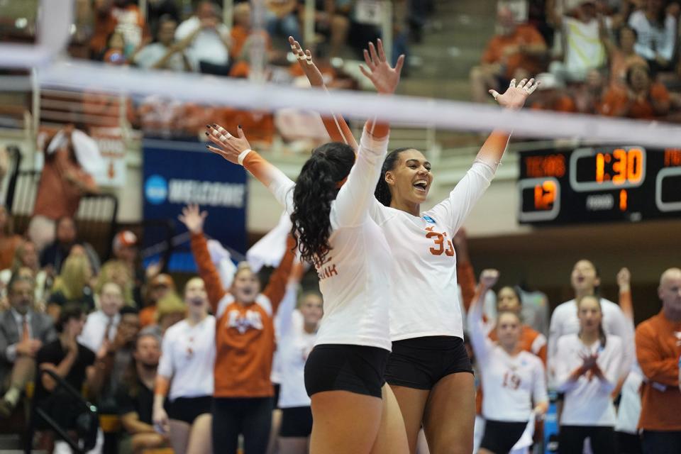 Texas outside hitter Logan Eggleston, right, cheers after scoring a point during Texas' 3-1 win over Marquette in Thursday's Sweet 16 match at Gregory Gym. Eggleston had 15 kills to lead the Longhorns, who'll face Ohio State in Saturday's Elite Eight.