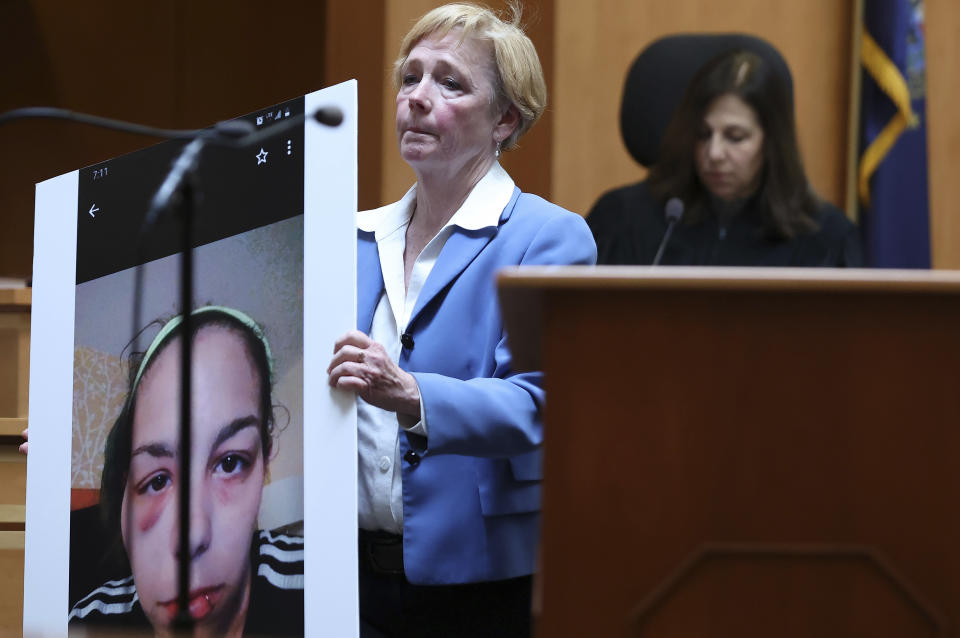Defense attorney Caroline Smith displays a photograph of Kayla Montgomery, Adam Montgomery's estranged wife, to the jury during closing arguments in Adam Montgomery's trial, Wednesday, Feb. 21, 2024, in Manchester, N.H. Adam Montgomery is accused of killing his 5-year-old daughter Harmony Montgomery. (Jim Davis/The Boston Globe via AP, Pool)