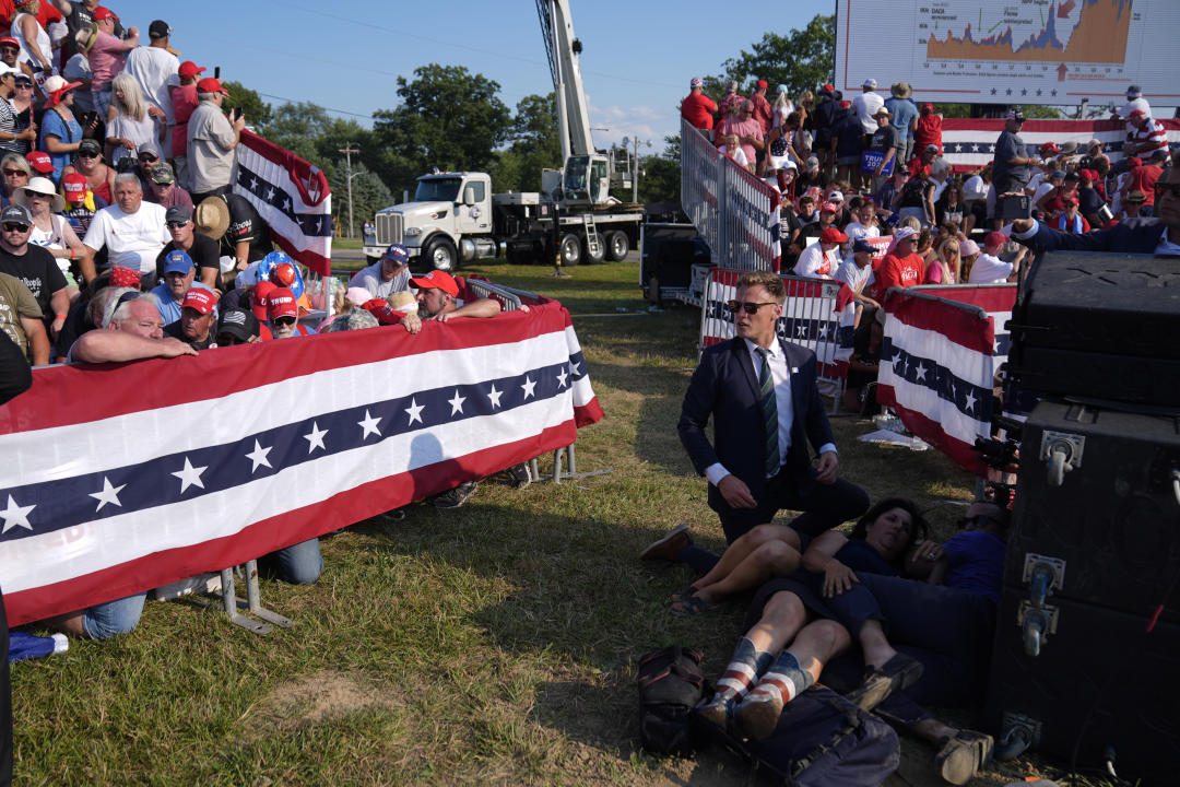 People react during a campaign rally with Republican presidential candidate former President Donald Trump at a campaign rally, Saturday, July 13, 2024, in Butler, Pa. (AP Photo/Evan Vucci)