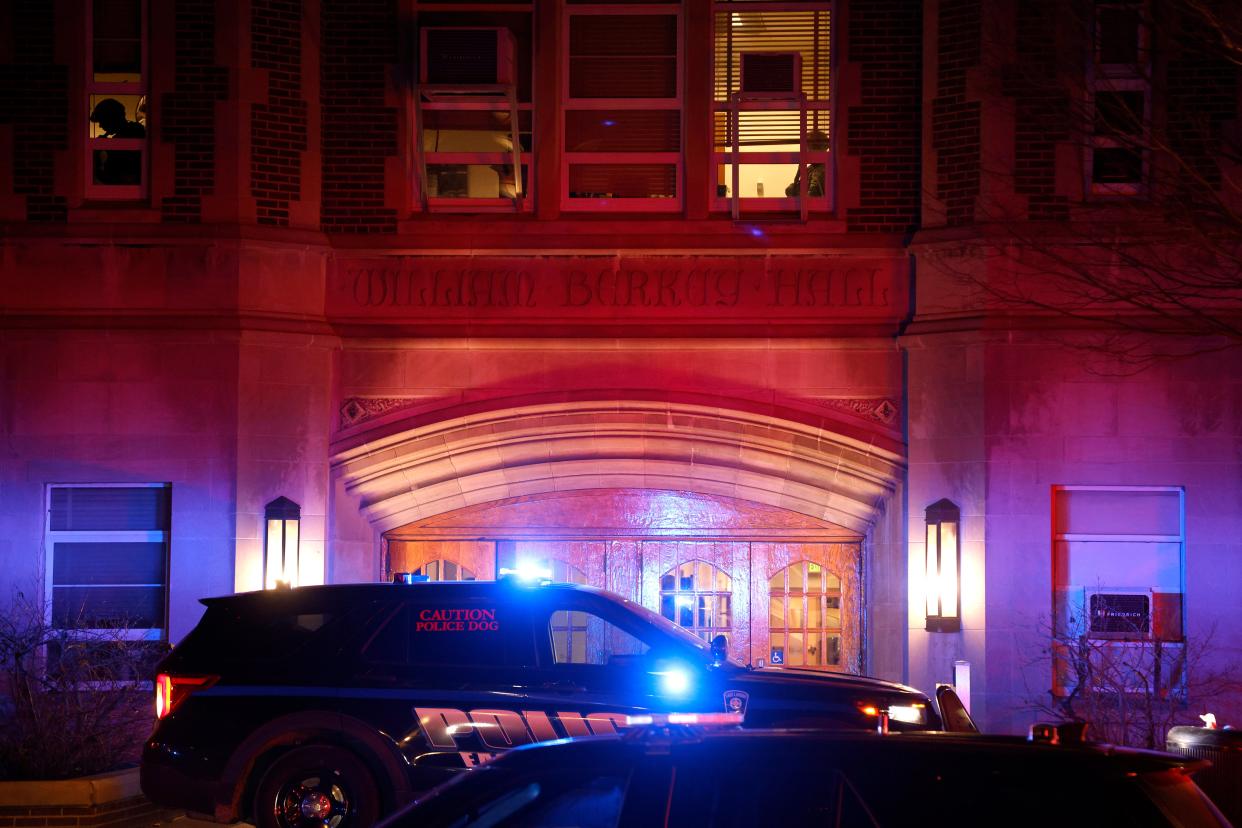 Police investigate the scene of a shooting at Berkey Hall on the campus of Michigan State University, late Monday, 13 February 2023, in East Lansing (AP)