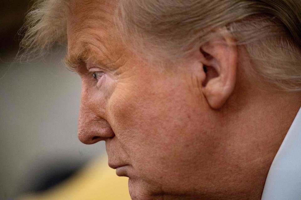 US President Donald Trump pause while speaking before a meeting with Guatemala's President Jimmy Morales in the Oval Office of the White House December 17, 2019, in Washington, DC.