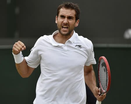 Marin Cilic of Croatia reacts during his match against John Isner of the U.S.A. at the Wimbledon Tennis Championships in London, July 3, 2015. REUTERS/Toby Melville