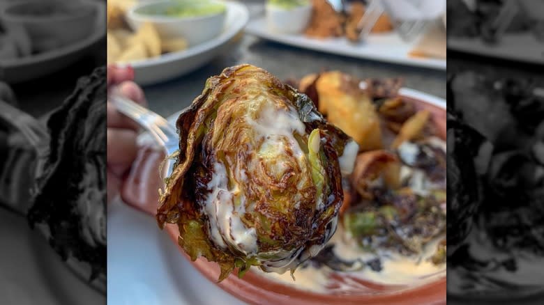 fork holding a Brussels sprout