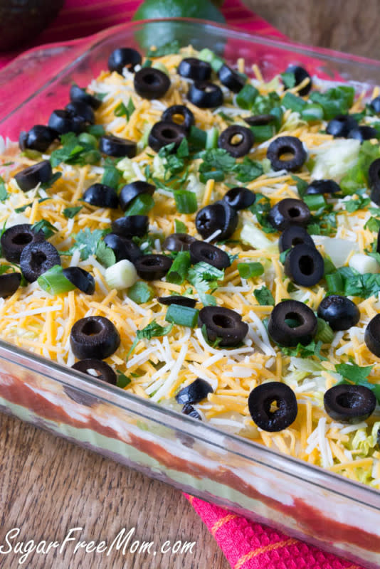 <p>Sugar Free Mom</p><p>A healthier version of the classic 7-Layer Dip that takes guacamole to a whole new level!</p><p><a href="http://www.sugarfreemom.com/recipes/lightened-up-7-layer-dip-with-whipped-guacamole/" rel="nofollow noopener" target="_blank" data-ylk="slk:Get the recipe!;elm:context_link;itc:0;sec:content-canvas" class="link rapid-noclick-resp">Get the recipe!</a></p>