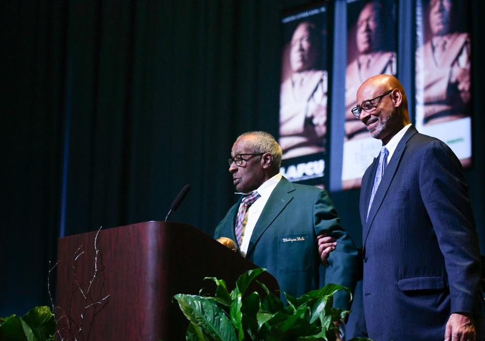 Former Michigan State University track and field coach James Bibbs, left, speaks Monday, Jan. 15, 2024, after receiving the King Legacy of Service Award, during the 39th annual Martin Luther King Jr. Day of Celebration at the Lansing Center in downtown. Bibbs was the first Black head coach at Michigan State University, and the first Black head track coach in the Big 10 conference. Also pictured is his son Andrew Wells.
