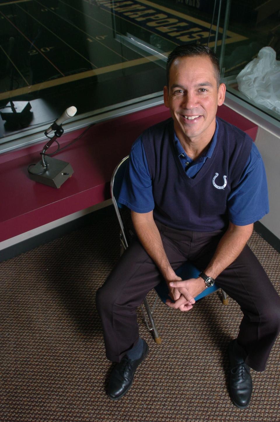 Mike Jansen 41, a stadium announcer for the Indianapolis Colts poses in the announcers booth inside the RCA Dome.