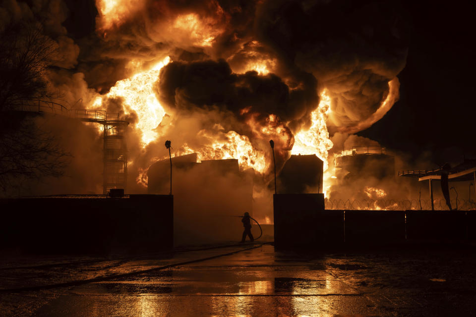 Firefighters put out the on a gas station fire after a Russian attack on a residential neighborhood in Kharkiv, Ukraine Saturday, Feb. 10, 2024.(AP Photo/Yevhen Titov)