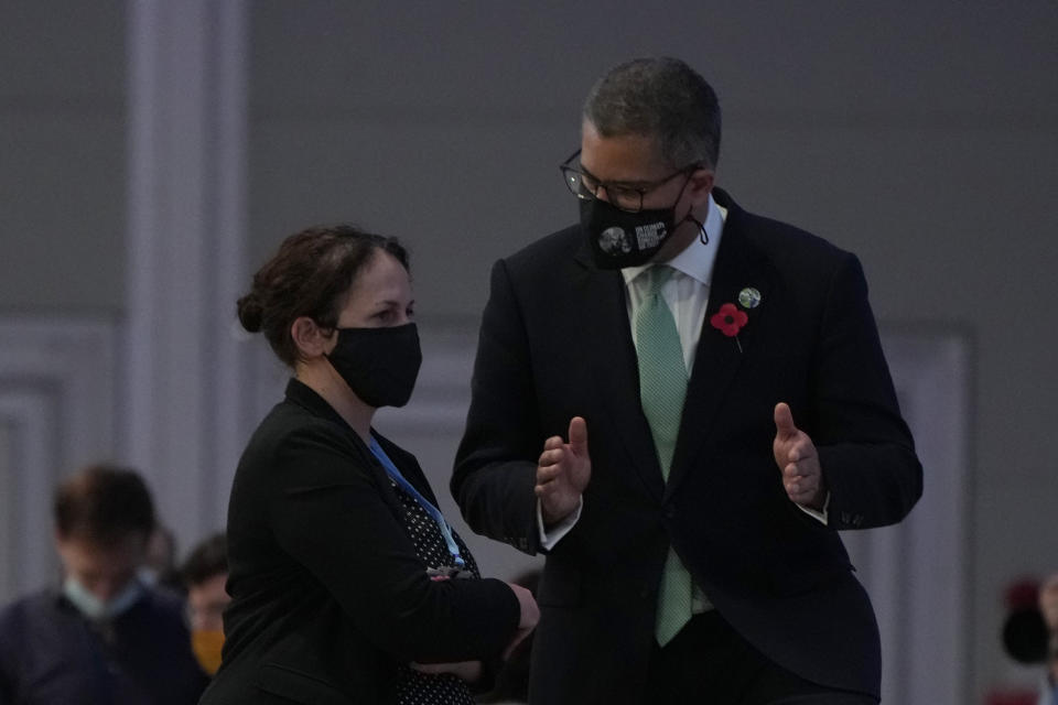 Alok Sharma, right, President of the COP26 gestures as he has a discussion during a stocktaking plenary session at the COP26 U.N. Climate Summit, in Glasgow, Scotland, Saturday, Nov. 13, 2021. Going into overtime, negotiators at U.N. climate talks in Glasgow are still trying to find common ground on phasing out coal, when nations need to update their emission-cutting pledges and, especially, on money. (AP Photo/Alastair Grant)