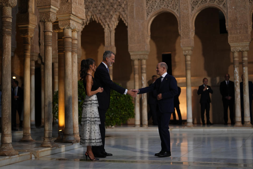 Germany's Chancellor Olaf Scholz, right is greeted by Spain's King Felipe VI and Queen Letizia at the Alhambra palace during the Europe Summit in Granada, Spain, Thursday, Oct. 5, 2023. Almost 50 European leaders are using a summit in southern Spain's Granada to stress they stand by Ukraine at a time when Western resolve appears somewhat weakened. Ukrainian President Volodymyr Zelenskyy retorted on Thursday that maintaining such unity was now "the main challenge."(AP Photo/Manu Fernandez)