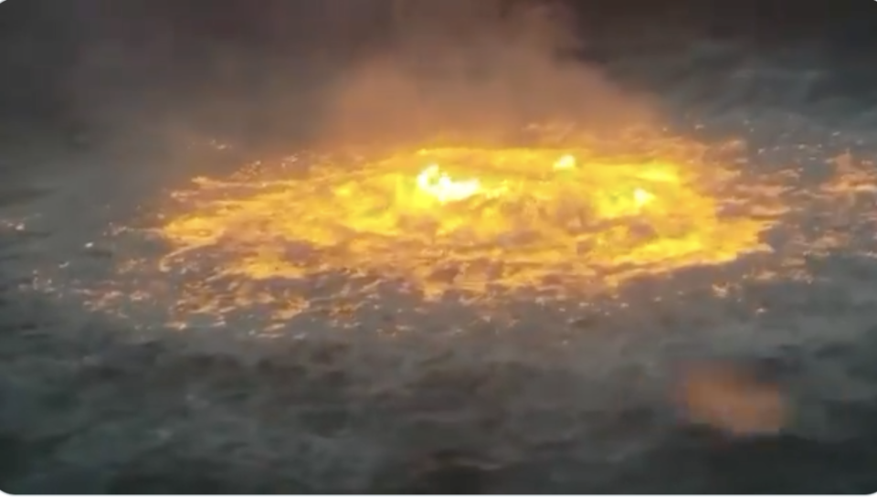 The raging fire on the ocean surface.