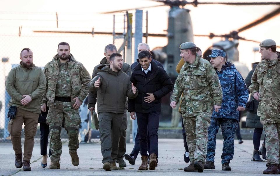 Ukraine's President Volodymyr Zelensky (C-L) and Britain's Prime Minister Rishi Sunak - ANDREW MATTHEWS/POOL/AFP