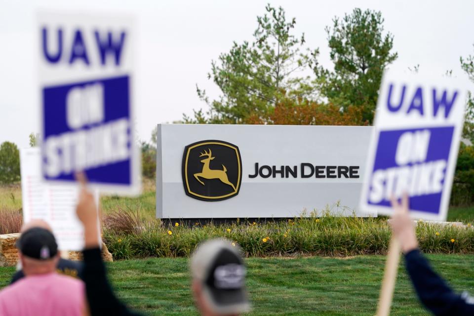 Members of the United Auto Workers strike outside of a John Deere plant Oct. 20 in Ankeny, Iowa.