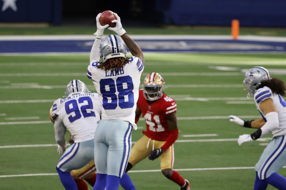 Dallas Cowboys wide receiver CeeDee Lamb (88) reaches up to catch an onside kick as San Francisco 49ers cornerback Emmanuel Moseley (41) looks on in the second half of an NFL football game in Arlington, Texas, Sunday, Dec. 20, 2020. Lamb returned the kick for a touchdown. (AP Photo/Ron Jenkins)