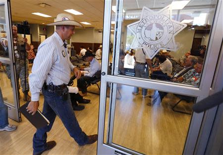 Ammon Bundy, son of rancher Cliven Bundy, files a criminal complaint against the Bureau of Land Management at the Las Vegas Metropolitan Police Department in Las Vegas, Nevada May 2, 2014. REUTERS/Mike Blake