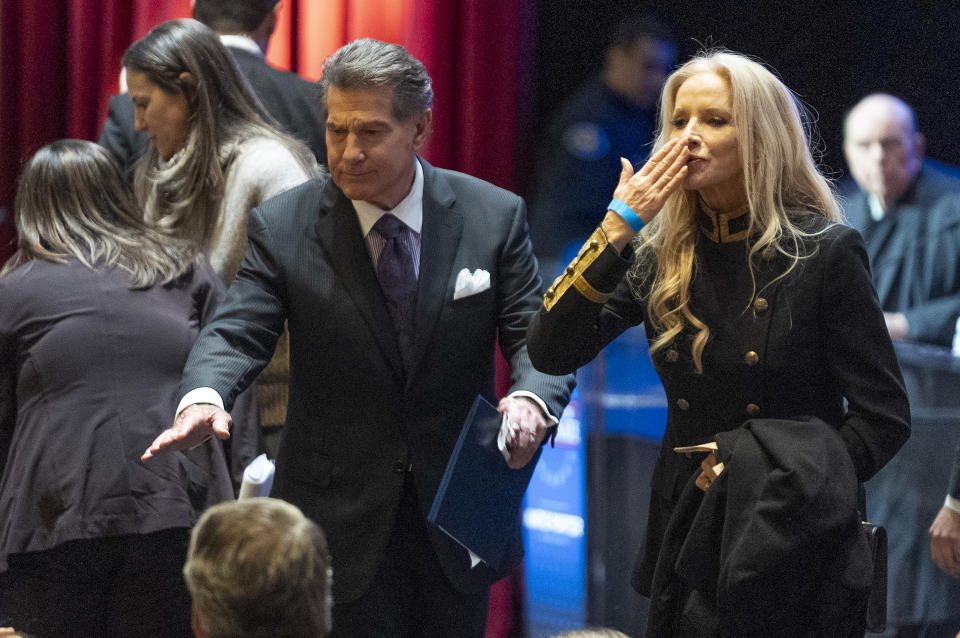 FILE - Former baseball player Steve Garvey and his wife, Cadance Garvey, greet supporters at the end of a televised debate for candidates in the senate race to succeed the late California Sen. Dianne Feinstein on Jan. 22, 2024, in Los Angeles. The candidacy for the U.S. Senate of former Los Angeles Dodgers star Garvey has brought a splash of celebrity to the race that has alarmed his Democratic rivals and tugged at the state's political gravity. (AP Photo/Damian Dovarganes, File)