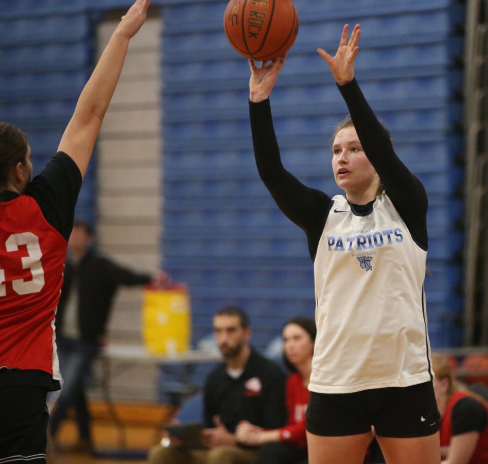 John Jay's Gabby Sweeney takes a shot over Red Hook's Emilie Kent during Thursday's scrimmage on November 30, 2023.