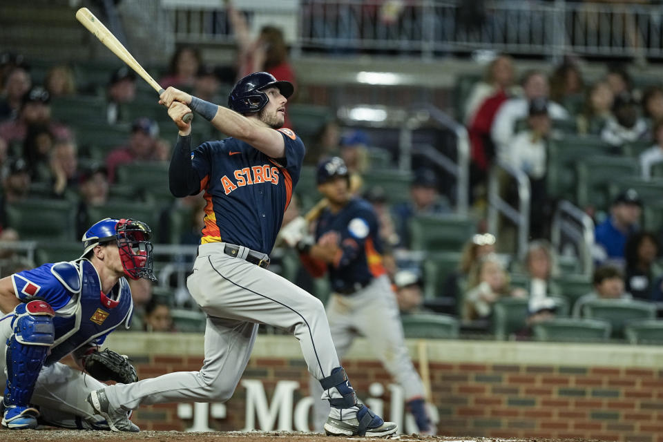 Houston Astros' Kyle Tucker (30) hits a two-run home run in the sixth inning of a baseball game against the Atlanta Braves, Saturday, April 22, 2023, in Atlanta. (AP Photo/Brynn Anderson)