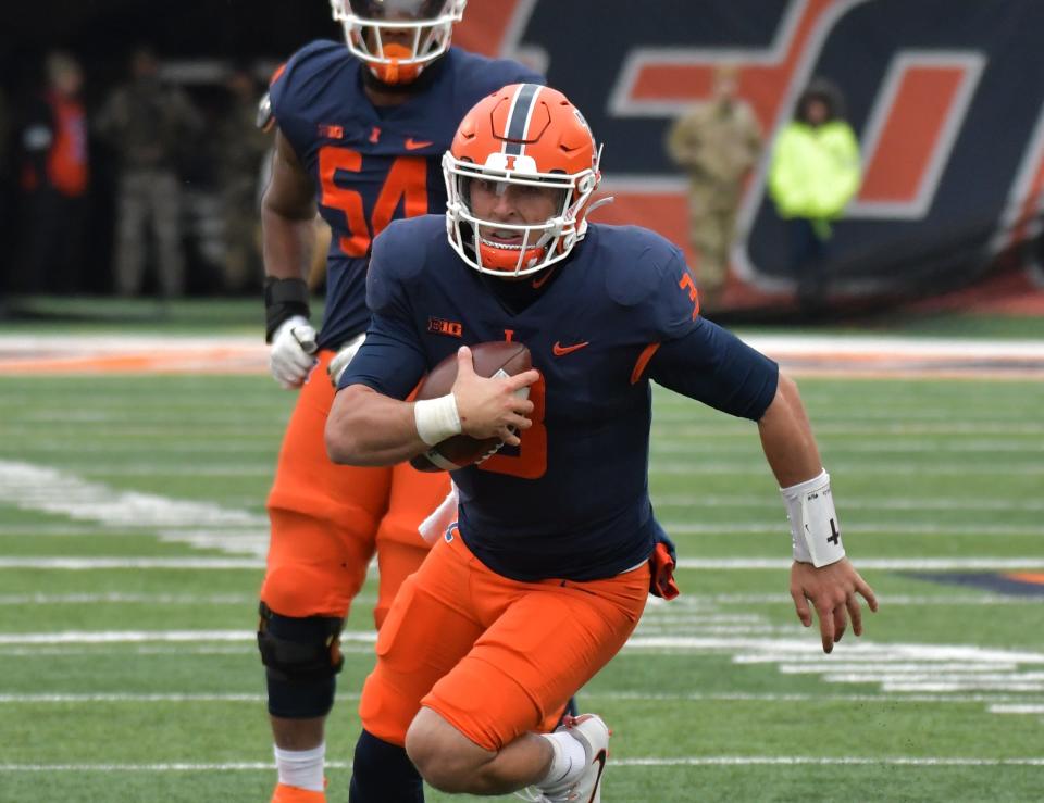 Nov 12, 2022; Champaign, Illinois, USA;  Illinois Fighting Illini quarterback Tommy DeVito (3)  runs with the ball during the first half against the Purdue Boilermakers at Memorial Stadium.