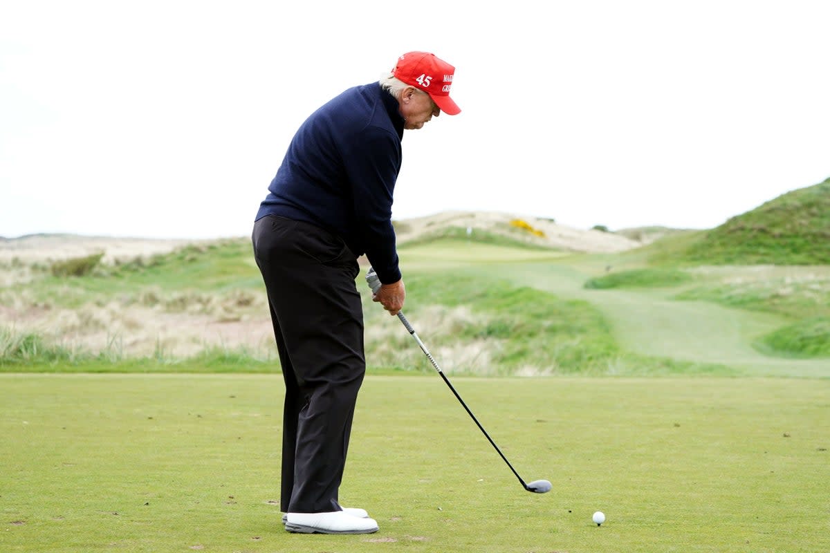 Former US president Donald Trump played golf on Tuesday afternoon (Jane Barlow/PA) (PA Wire)