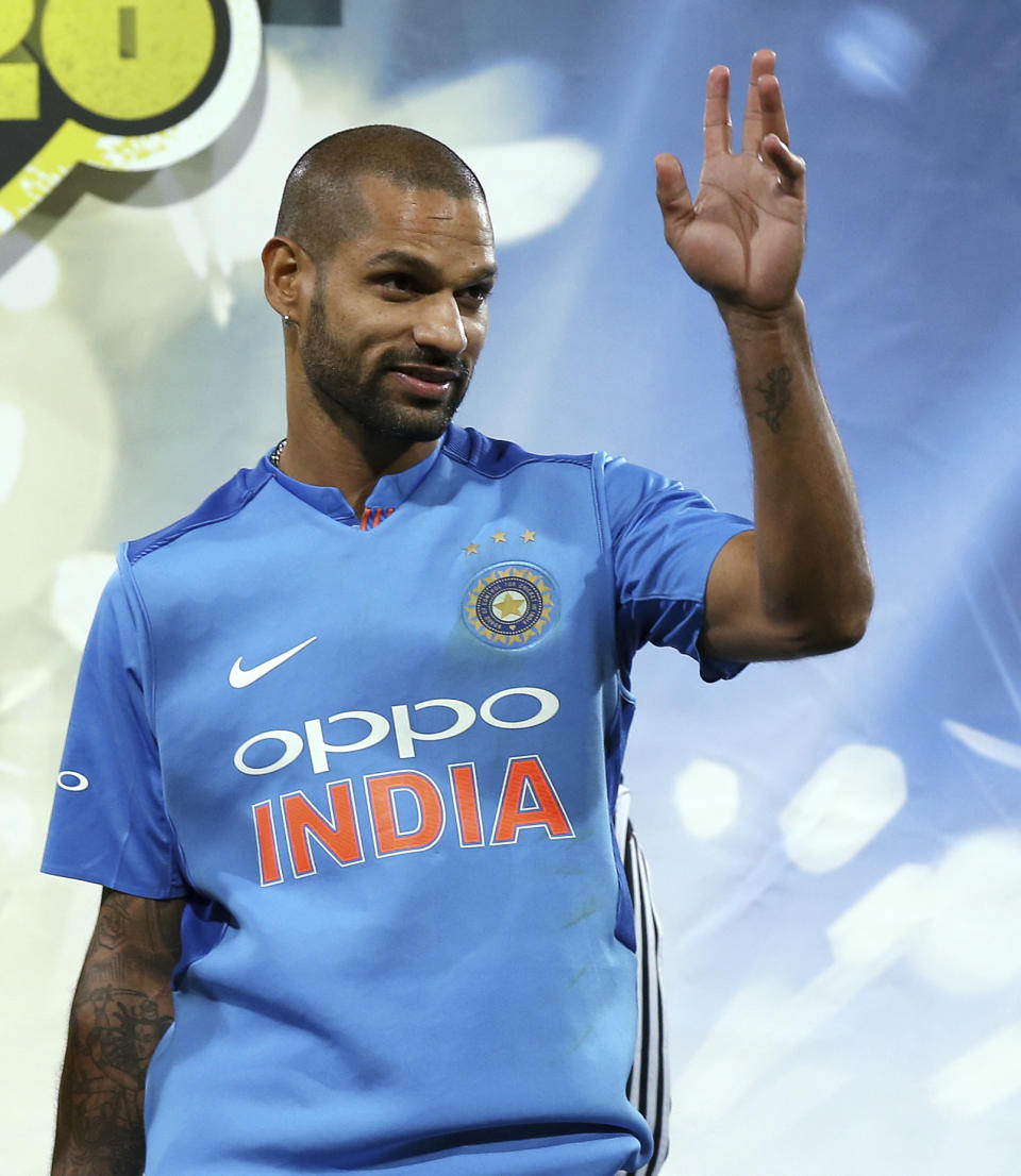 India's Shikhar Dhawan waves after being named man of the series after their Twenty20 cricket match against Australia in Sydney, Sunday, Nov. 25, 2018. India won the match and the series is drawn 1-1. (AP Photo/Rick Rycroft)