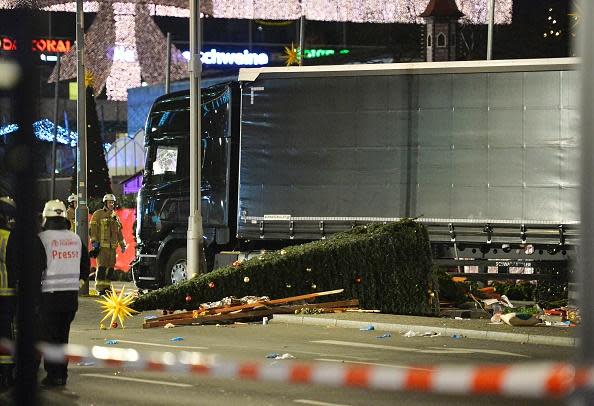 <p>A Christmas tree lies next to a truck that crashed into a Christmas market in Berlin. Photo: ODD ANDERSEN/AFP/Getty Images</p>