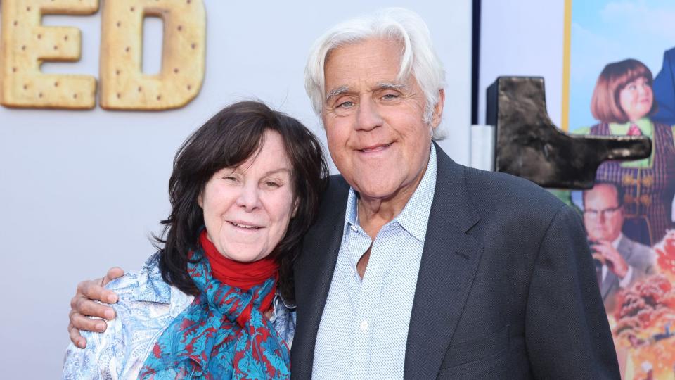 Jay Leno and wife Mavis Leno smile while attending "unfrosted" premiere.