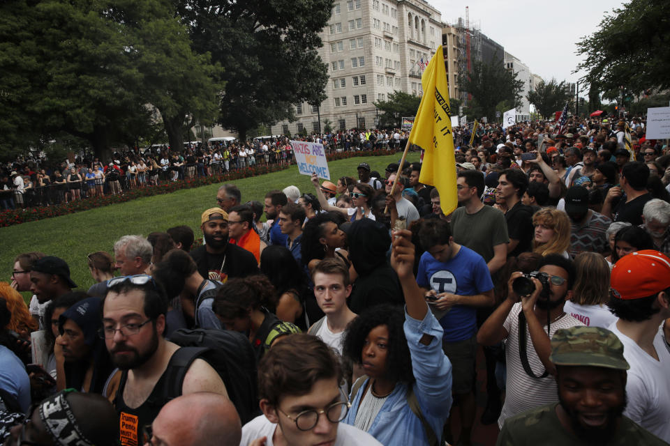 Demonstrators rally near the White House on the one year anniversary of the Charlottesville "Unite the Right" rally, Sunday, Aug. 12, 2018, in Washington. (AP Photo/Jacquelyn Martin)