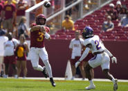 Iowa State quarterback Rocco Becht (3) sends a pass downfield over Northern Iowa defensive back Edwin Dearman (21) during the first half of an NCAA college football game, Saturday, Sept. 2, 2023, in Ames, Iowa. (AP Photo/Matthew Putney)