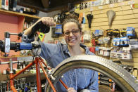 Shawna Williams, owner of Free Range Cycles, poses in her shop on May 6, 2024, in Seattle, Wash. Williams didn't have the sales surge others did because her 700 square foot shop was so small she kept it open by appointment only from March 2020 to May 2021. (AP Photo/Manuel Valdes)