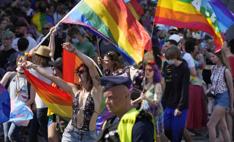 FILE - People take part in the Equality Parade, the largest gay pride parade in central and eastern Europe, in Warsaw, Poland, Saturday June 19, 2021. Despite the war in Ukraine, the country's largest LGBT rights event, KyivPride, is going ahead on Saturday, June 25, 2022. But not on its native streets and not as a celebration of gay pride. It will instead join Warsaw's yearly Equality Parade, using it as a platform to keep international attention focused on the Ukrainian struggle for freedom. (AP Photo/Czarek Sokolowski, File)