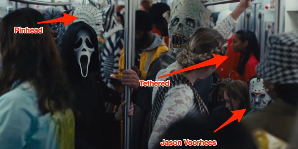 People in horror costumes on the subway in "Scream 6."