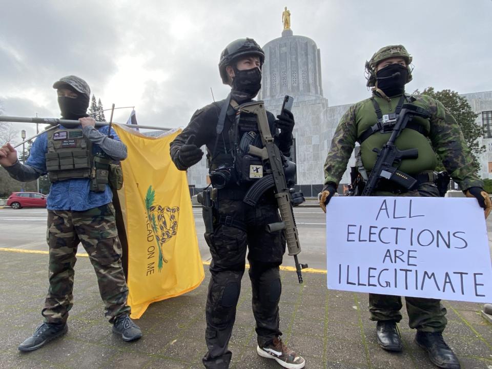 Armed protesters attend a rally at the Oregon State Capitol on Sunday.