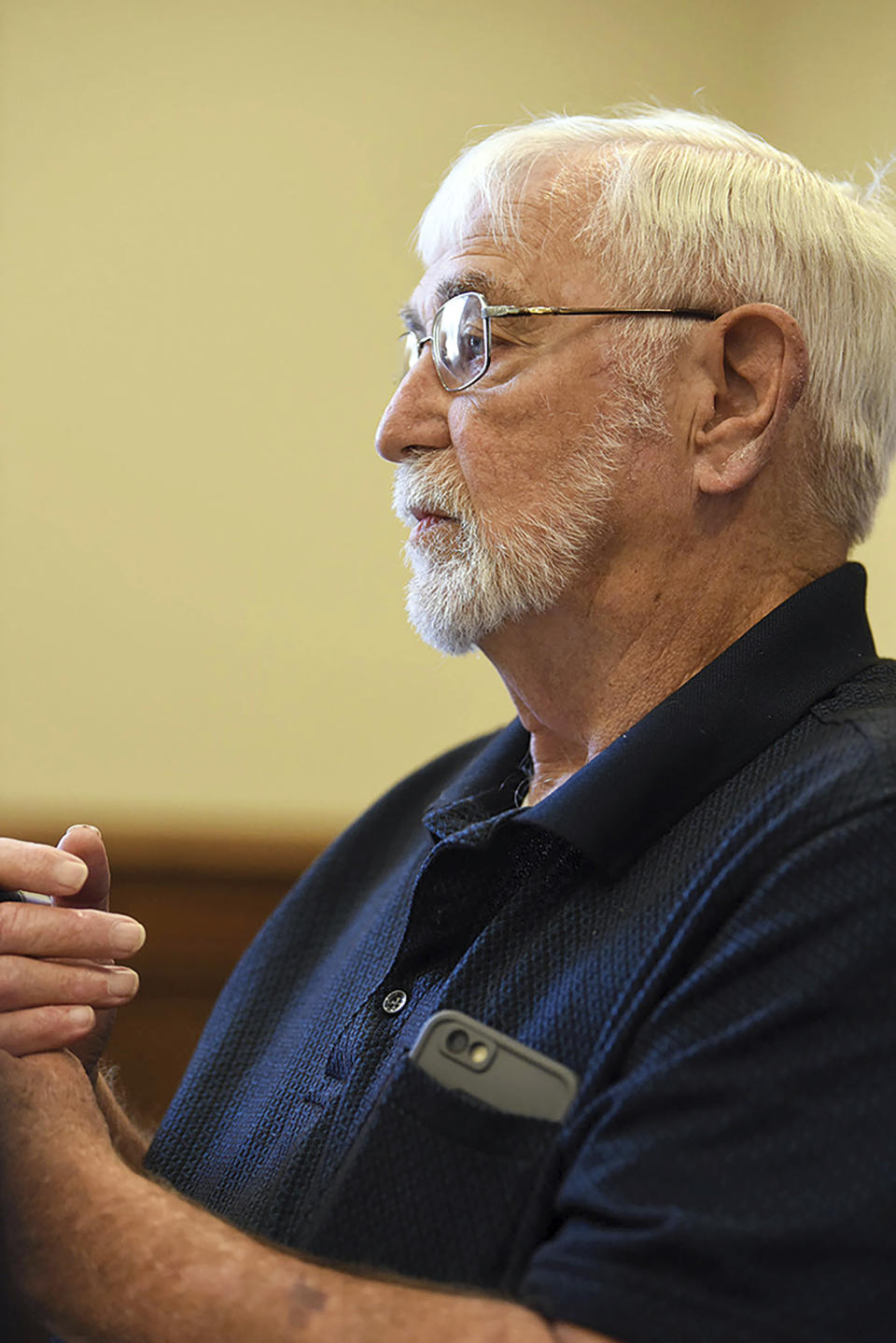 Lowndes County supervisor Harry Sanders listens as Bishop Scott Volland, unseen, asks the county to consider removing a Confederate monument from the courthouse lawn during a Lowndes County Board of Supervisors meeting, Monday, June 15, 2020, in Columbus, Miss. After rejecting a proposal to move the monument, Sanders said this week that African Americans “became dependent” during slavery and have had a harder time “assimilating” into American life as other groups who have been mistreated have. His remark has prompted calls for his resignation. (Claire Hassler/The Commercial Dispatch, via AP)