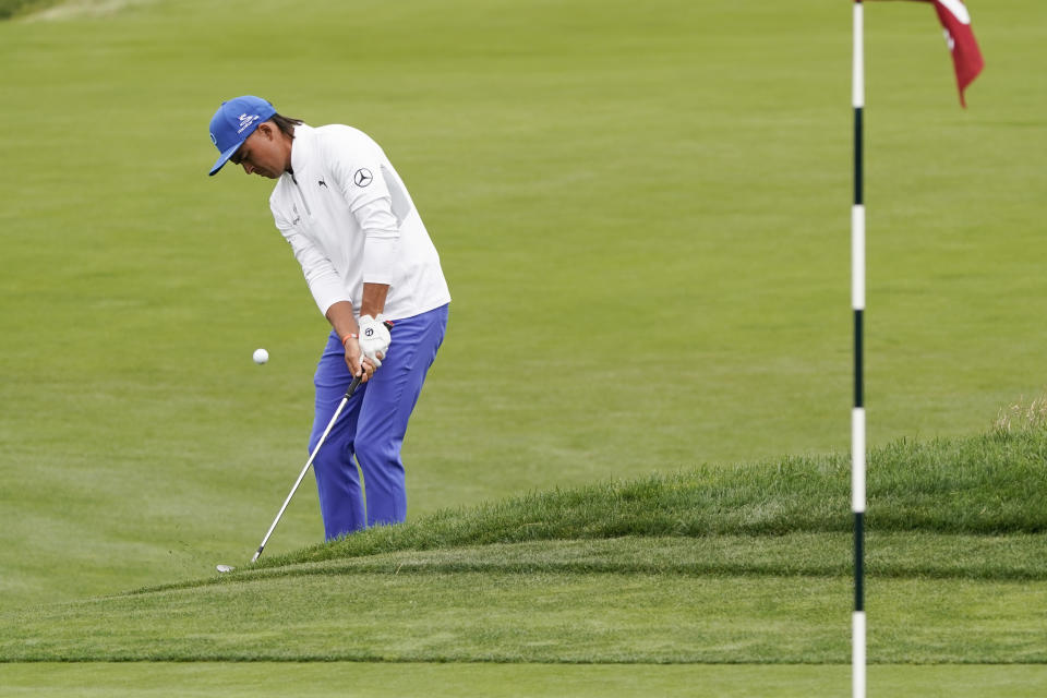 Rickie Fowler hits a chip shot on the ninth hole during the first round of the U.S. Open Championship golf tournament Thursday, June 13, 2019, in Pebble Beach, Calif. (AP Photo/David J. Phillip)