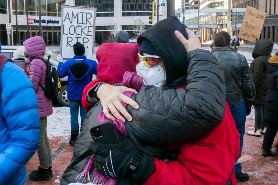Two protesters embrace at a racial justice rally for Amir Locke on February 5, 2022 in Minneapolis, Minnesota (Getty Images)
